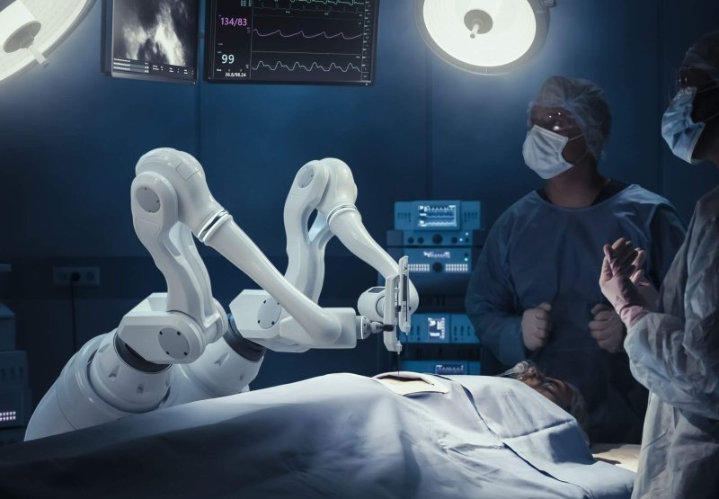 Two,Surgeons,Observing,High-precision,Programmable,Automated,Robot,Arms,Operating,Patient